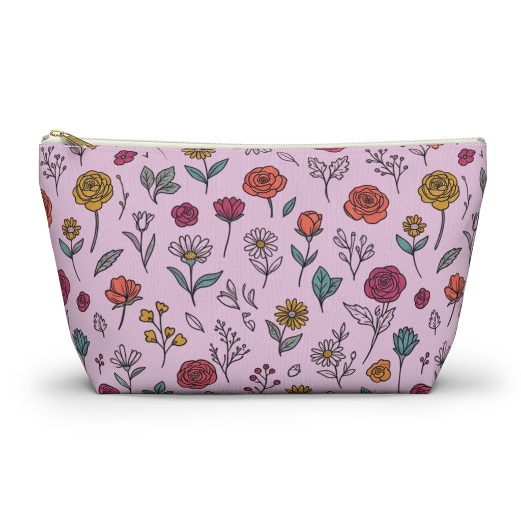 Floral doodle makeup pouch featuring colorful hand-drawn flowers on a pink background, perfect for organizing essentials.