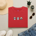 Panda Trio Graphic T-Shirt featuring cute cartoon panda faces, perfect for casual wear.