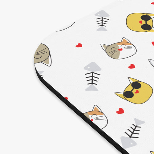 Cat-themed mouse pad featuring playful cat faces and fish designs in vibrant colors.