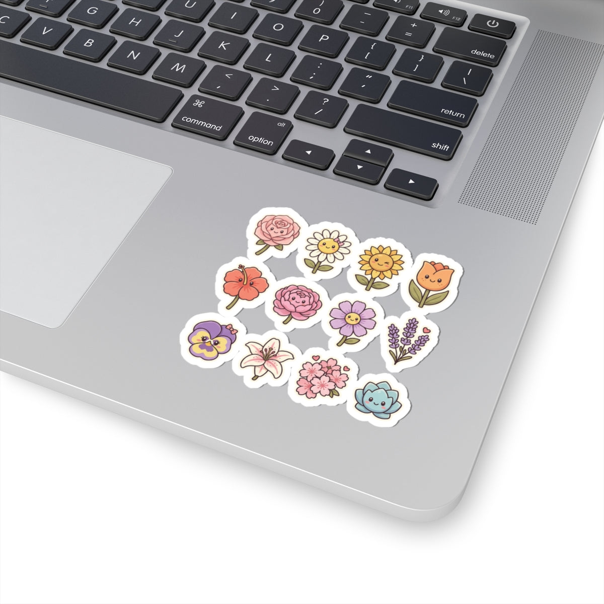 Cute floral kiss-cut stickers on a laptop, featuring vibrant hand-drawn flowers in pastel colors.