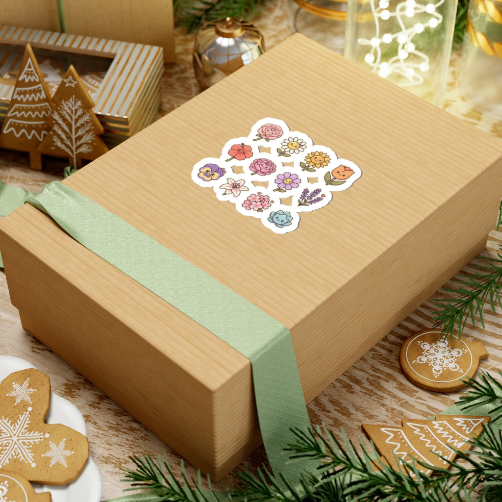 Cute floral kiss-cut stickers on a gift box, featuring cheerful hand-drawn flowers and a ribbon decoration.