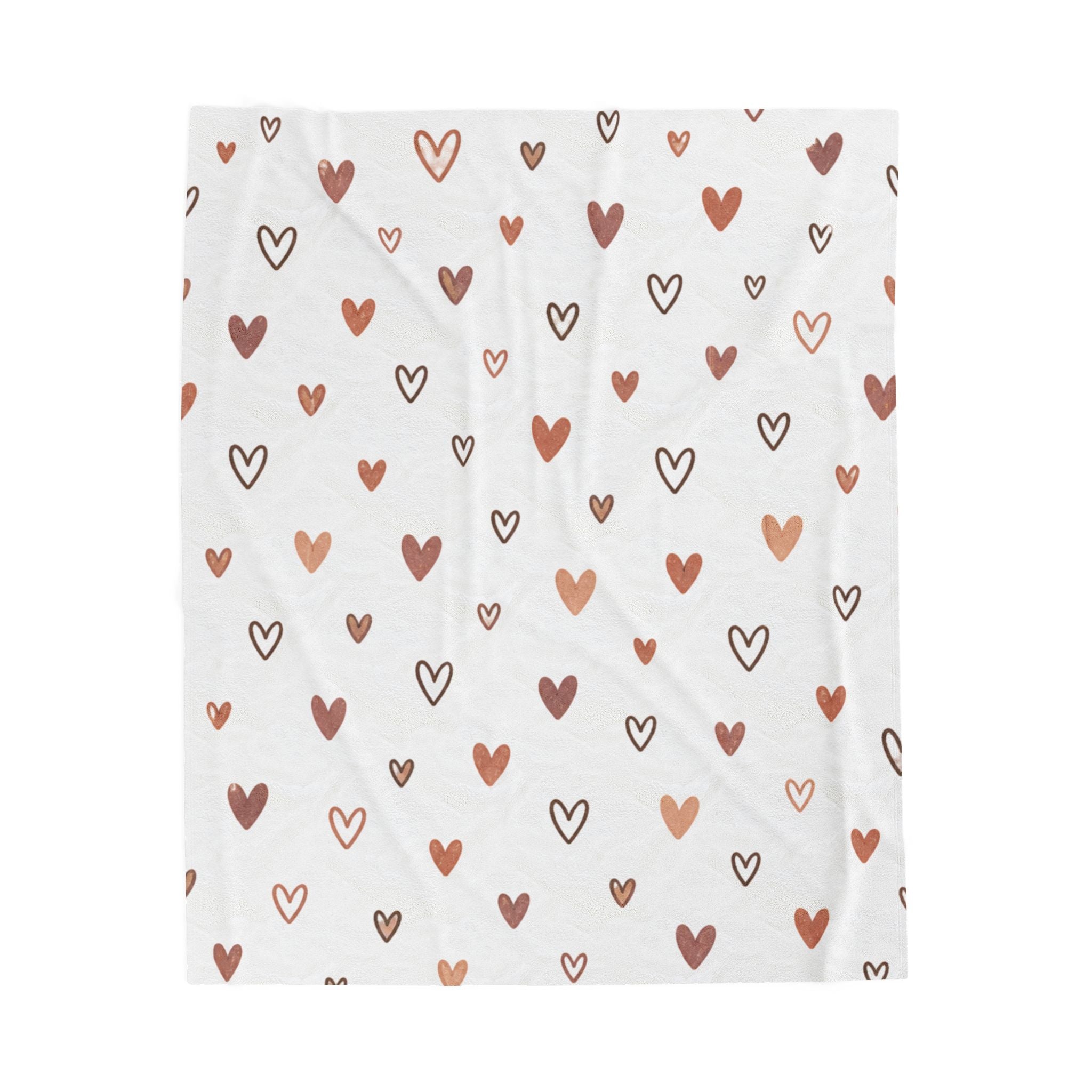 rose gold heart plush blanket with hand-drawn heart pattern in terracotta and warm brown tones on a white background.